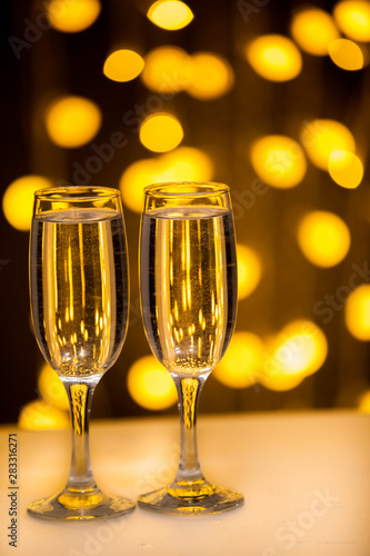 Two glasses on a background of illumination