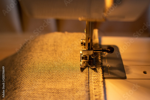 Jeans fabric on the sewing machine ready to saw