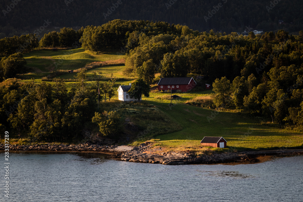 Farm houses in beautiful light in Northern Norway