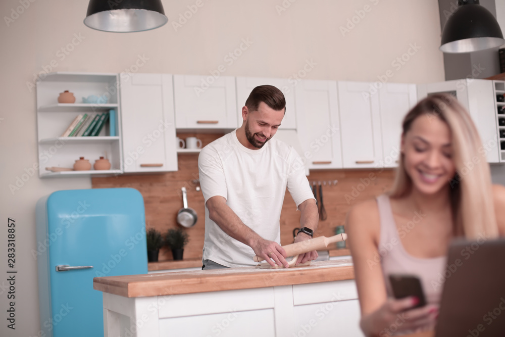 Fototapeta premium modern couple spends time in the kitchen