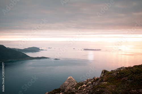 Fjord landscape in Norway with mountains and sea in the golden hour © Bernese Creative