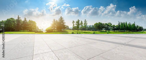 Empty square floor and green woods natural scenery in city park