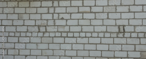 Brick wall. The window in the wall. Angled view. Overall plan..