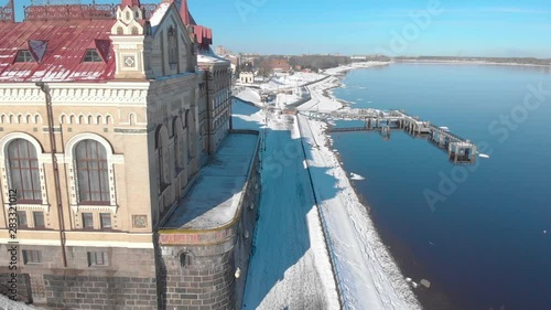Snowy city in winter and river pier