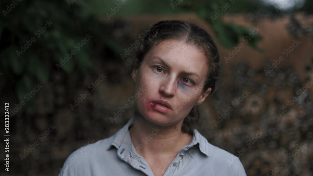 Horrible portrait of a battered woman outdoor. Women's Rights, Domestic Violence, Eastern Europe Horrible portrait of a battered woman outdoor. Women's Rights, Domestic Violence, Eastern Europe
