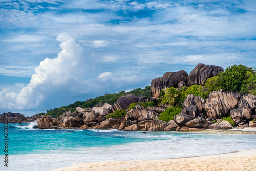 Grande Anse beach, La Digue island, Seychelles. Amazing natural landscape of paradise island and impressive clouds