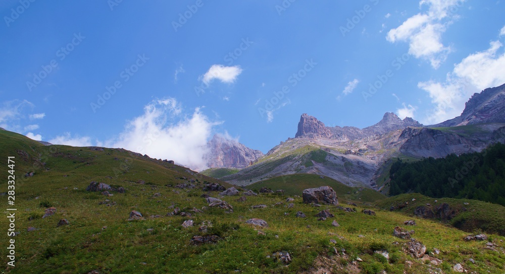 Summits and clouds in French alps, in the 