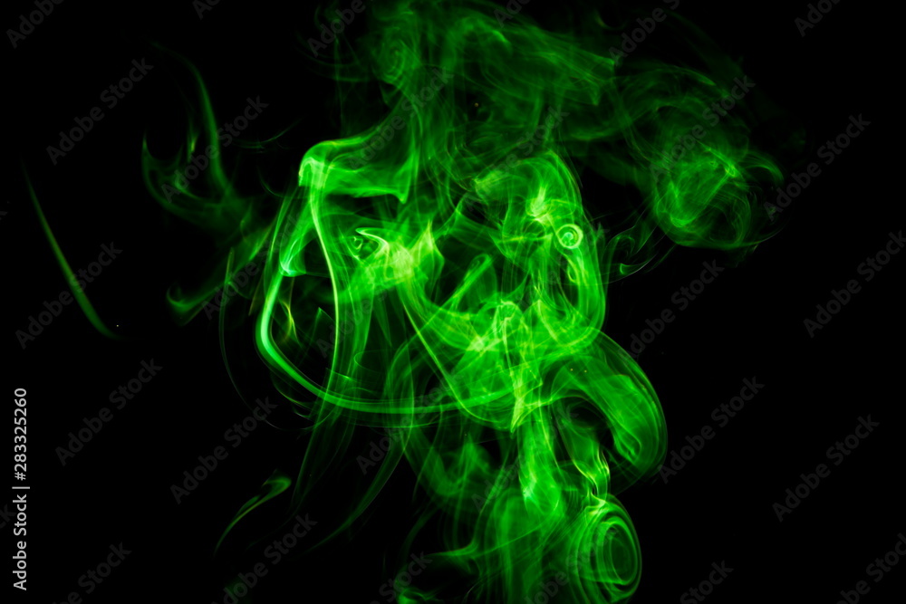 Green smoke on black background Green smoke on black background
