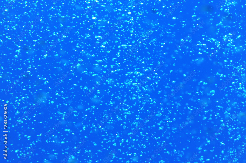 Background of air bubbles in blue water