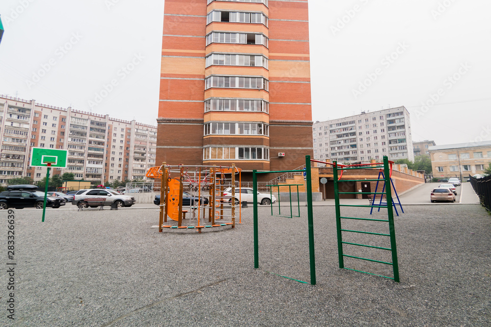 Russia, Novosibirsk - June 15, 2019: Russian courtyards. buildings, house architecture, exterior. city views Russia, Novosibirsk - June 15, 2019: Russian courtyards. buildings, house architecture, exterior. city views