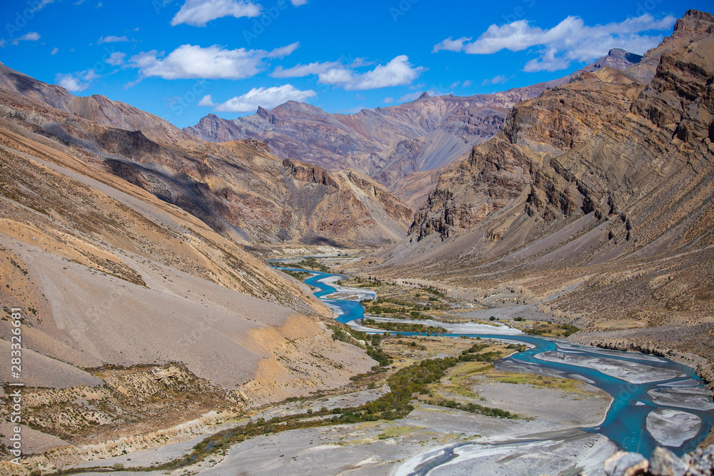 Himalayan mountain landscape along Leh to Manali highway. Blue river and rocky mountains in Indian Himalayas, India