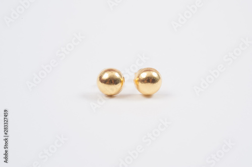 Gold Earrings on the white background.