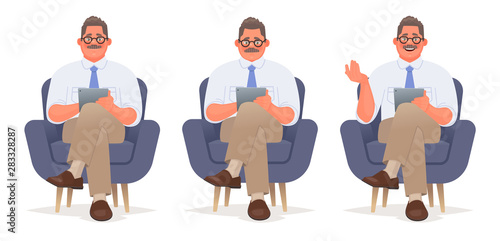Businessman or consultant is sitting in a chair with a tablet in his hands. Reads and talks. Psychologist character