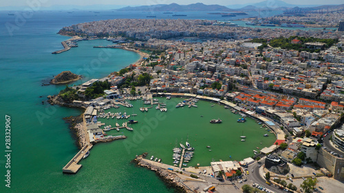 Aerial drone photo of iconic round shaped small port of Mikrolimano in the heart of Piraeus, Attica, Greece