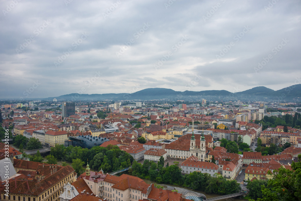 Cityscape of Graz with Mur river and Mariahilfer church (Mariahilferkirche), view from the Shlossberg hill, in Graz, Styria region, Austria