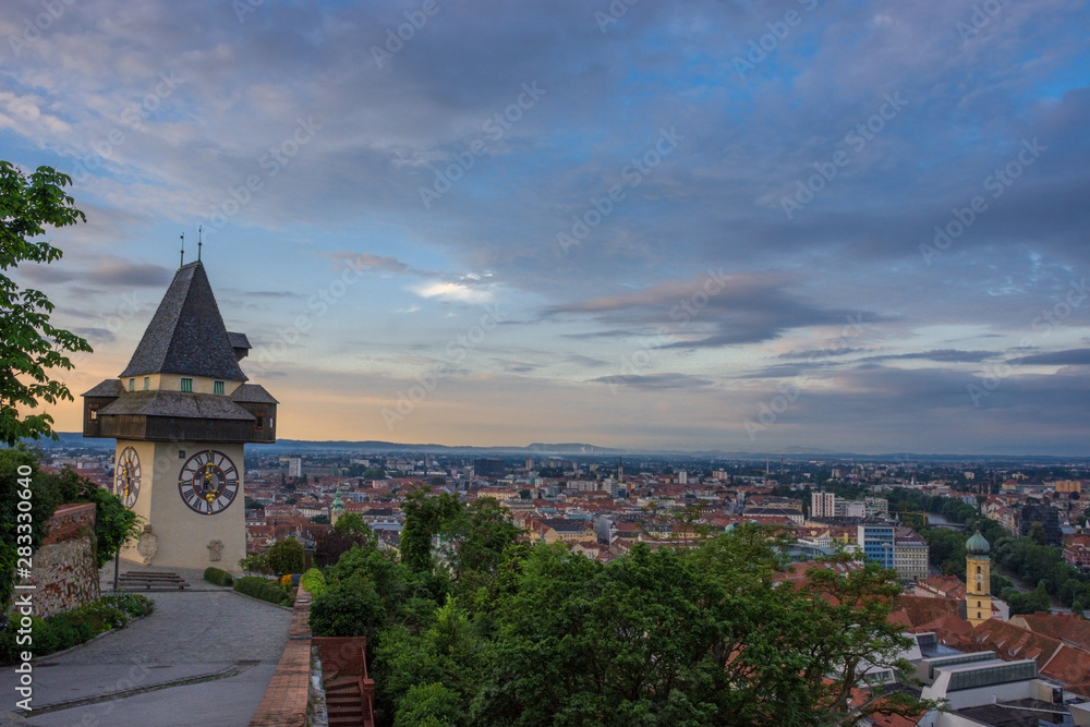 Cityscape of Graz and the famous clock tower (Grazer Uhrturm) on Shlossberg hill, Graz, Styria region, Austria Cityscape of Graz and the famous clock tower (Grazer Uhrturm) on Shlossberg hill, Graz, Styria region, Austria