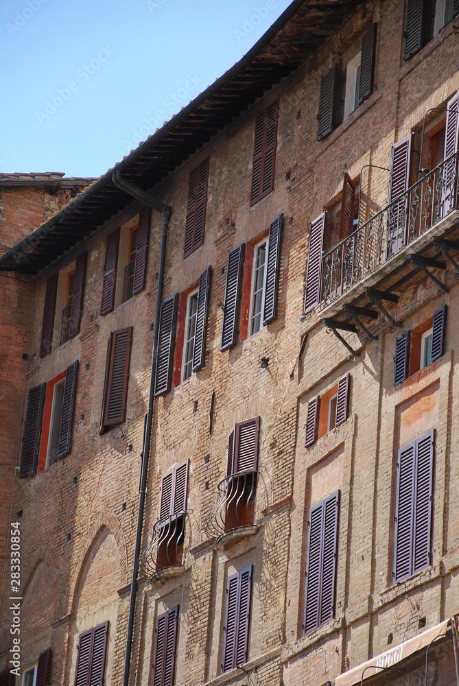 Buildings in the Il Campo square in central Siena, Tuscany, Italy