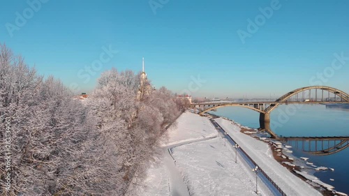 Snowy city in winter and river pier