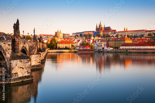 View of Old Town with Prague Castle and Charles Bridge at sunrise in Prague, Czech Republic. Famous travel destination