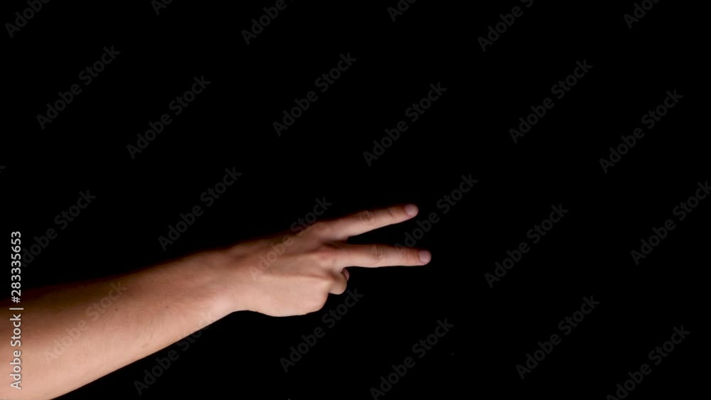 Rock paper scissors game hand gesture symbol sideways on a black background Rock paper scissors game hand gesture symbol sideways on a black background
