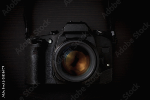 Professional SLR film camera on a black background