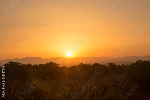 HDR image of a sunset behind the mountains during a warm Summer evening in Augsut seen over Alicante City 