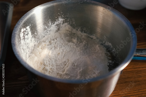 flour in bowl, kneading dough, puff pastry dough manufacturing p