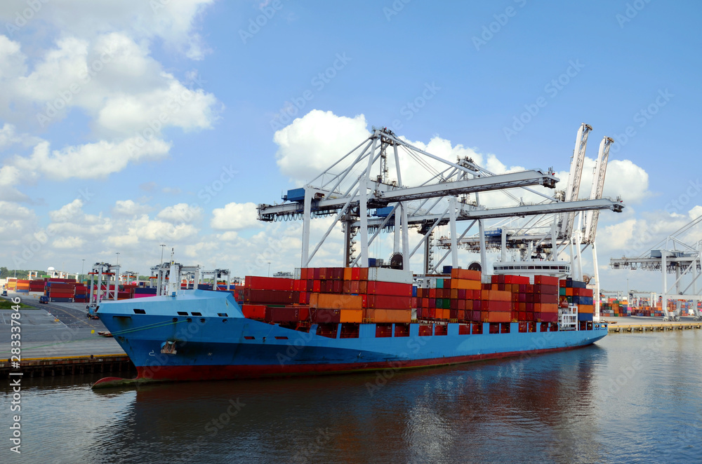 Fototapeta premium Cargo container ship in the port of Savannah, Georgia. 