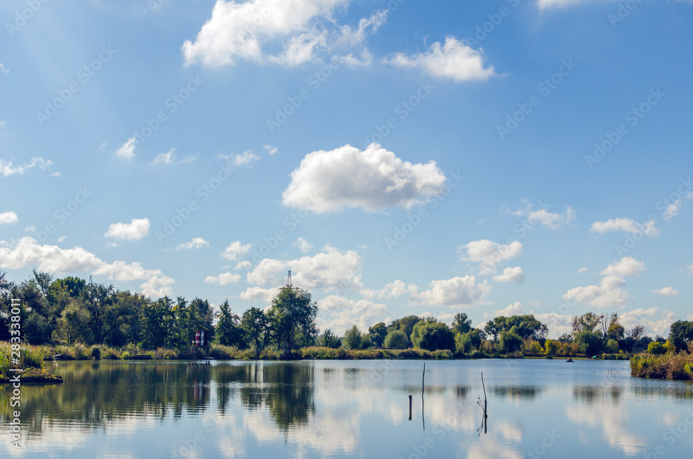 Beautiful summer landscape with a river and blue sky.
