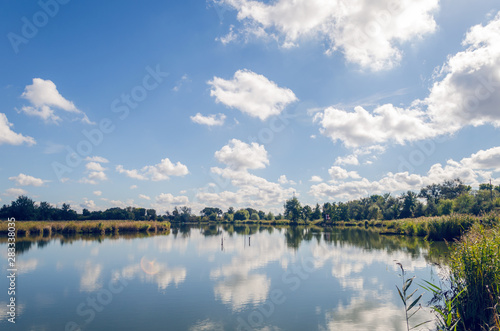 Beautiful summer landscape with a river and blue sky.