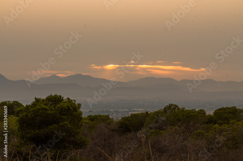 a susnet bea sunset behind the mountains during a warm Summer evening in Augsut seen over Alicante City hind the mountains during a warm Summer evening in Augsut seen over Alicante City 