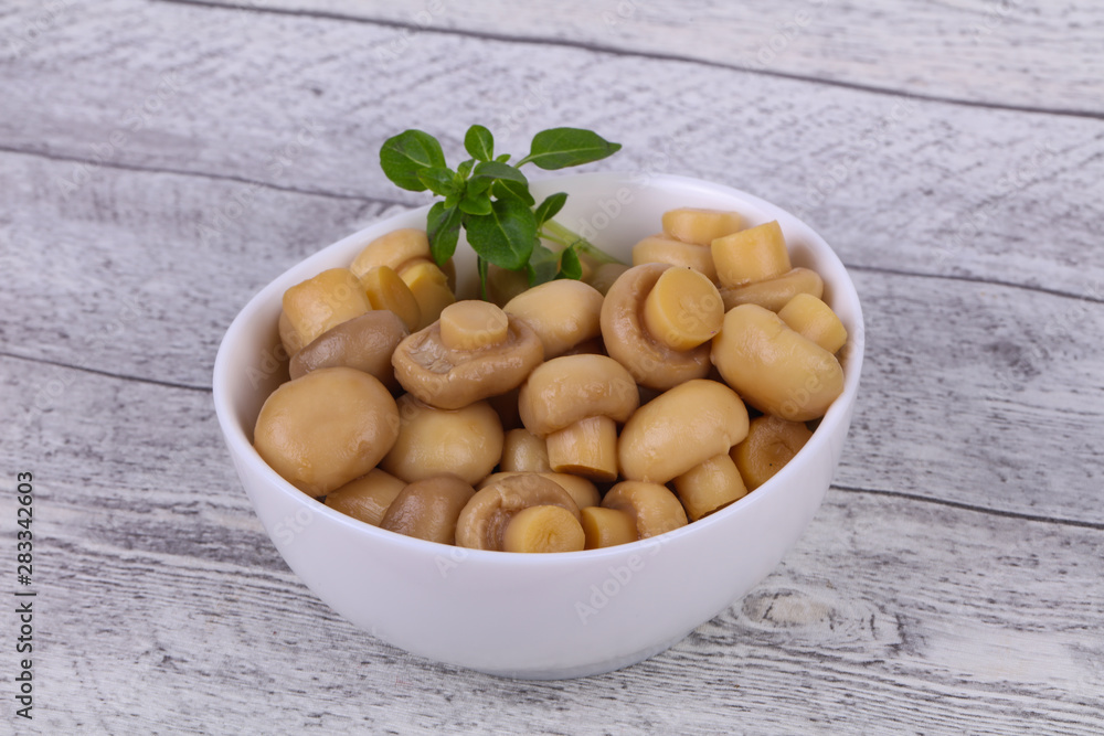 Pickled champignon heap in the bowl Pickled champignon heap in the bowl