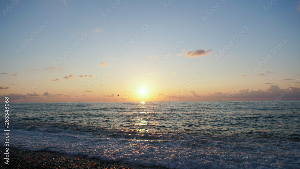 Bright sky and sundown. Abstract composition. Beautiful sunset on the beach and sea. Sunset Twilight Dusk Beach Wave San Concept Bright sky and sundown. Abstract composition. Beautiful sunset on the beach and sea. Sunset Twilight Dusk Beach Wave San Concept