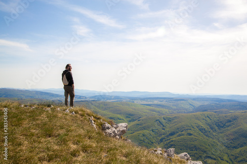 A man on the edge of a cliff photo