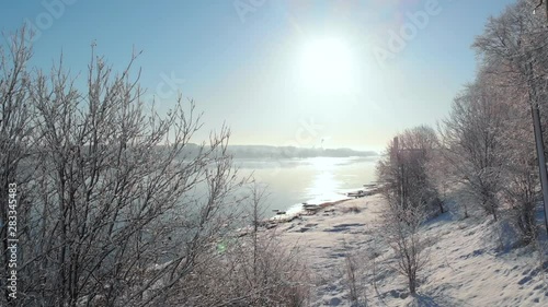 Snowy city in winter and river pier