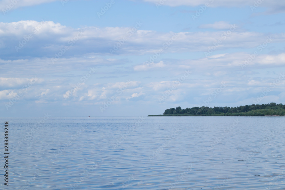 Blue sky with clouds reflected in water. Beautiful seascape. Blue sky with clouds reflected in water. Beautiful seascape.