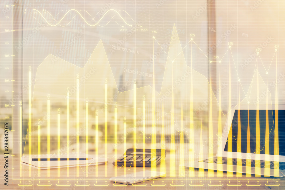 Forex Chart hologram on table with computer background. Double exposure. Concept of financial markets. Forex Chart hologram on table with computer background. Double exposure. Concept of financial markets.