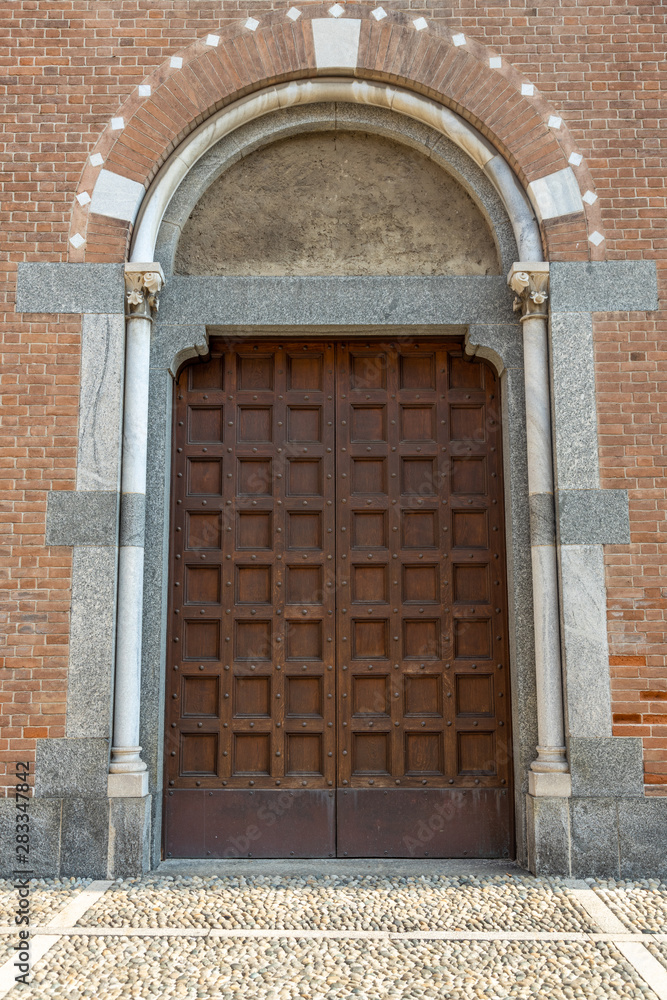 medieval wooden arched church door Monza, Italy medieval wooden arched church door Monza, Italy