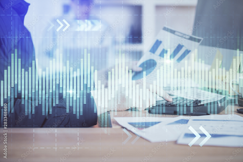 Double exposure of graph with man typing on computer in office on background. Concept of hard work. Closeup. Double exposure of graph with man typing on computer in office on background. Concept of hard work. Closeup.