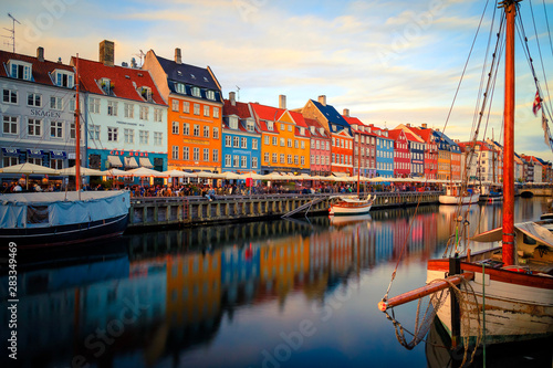 Canvas Print Nyhavn Harbour at sunset in Copenhagen Denmark with colorful houses reflection a