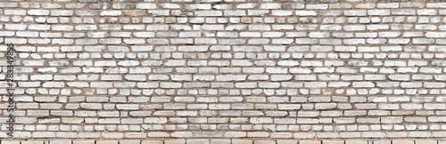 Old vintage dirty white brick wall texture. Brick panoramic background
