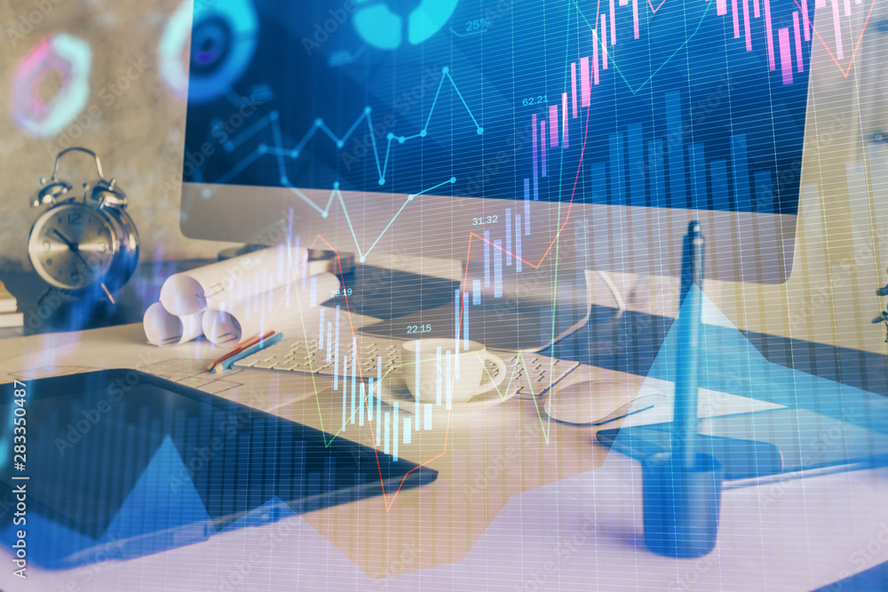 Financial chart drawing and table with computer on background. Multi exposure. Concept of international markets.