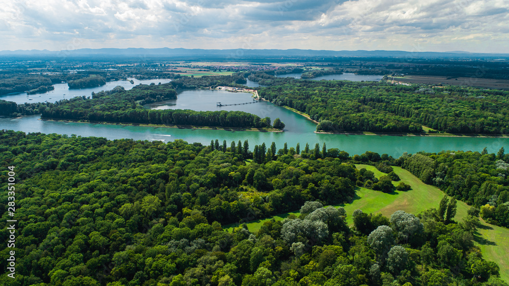 Aerial View of Green Park and River with City in Background