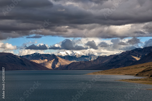 Stormy sky over Tso Moriri lake in Ladakh region, India. The lake is at an altitude of 4,522 mt. and accessibility is largely limited to summer season. The area are a protected reserve © francis92