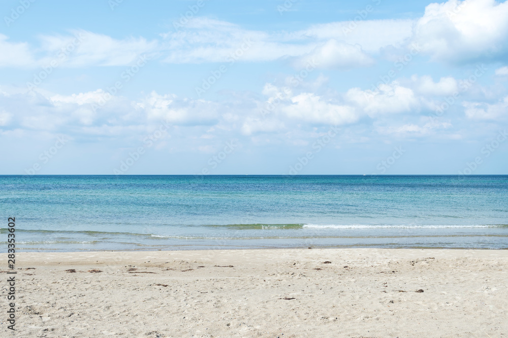 Beautiful seascape with sandy beach and beautiful cloudy sky. Nature. Relaxation.