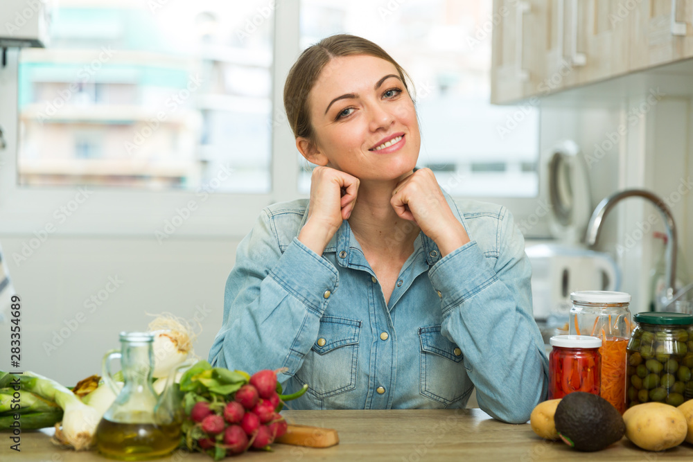 custom made wallpaper toronto digitalSmiling housewife sitting in kitchen