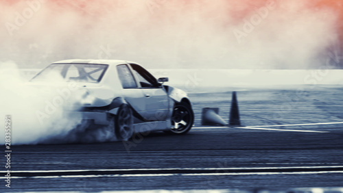 Motion blur speed car drifting with rubber smoke by professional driver on speed track racing. © applezoomzoom