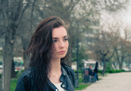 Sad girl with pensive hair posing outside in the park © mettus