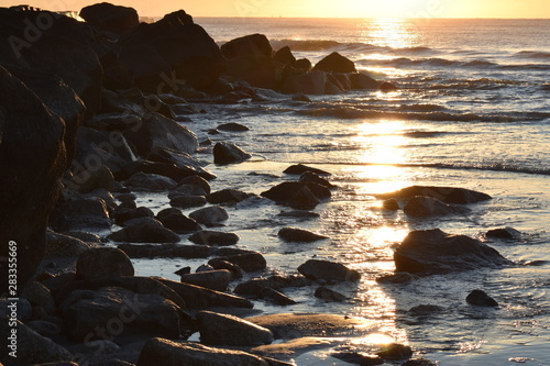 Rocky Barrier with Sunrise at the Beach