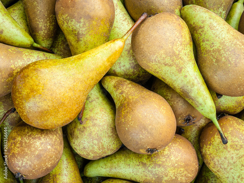 Conference pears varieties lie in a box in the market